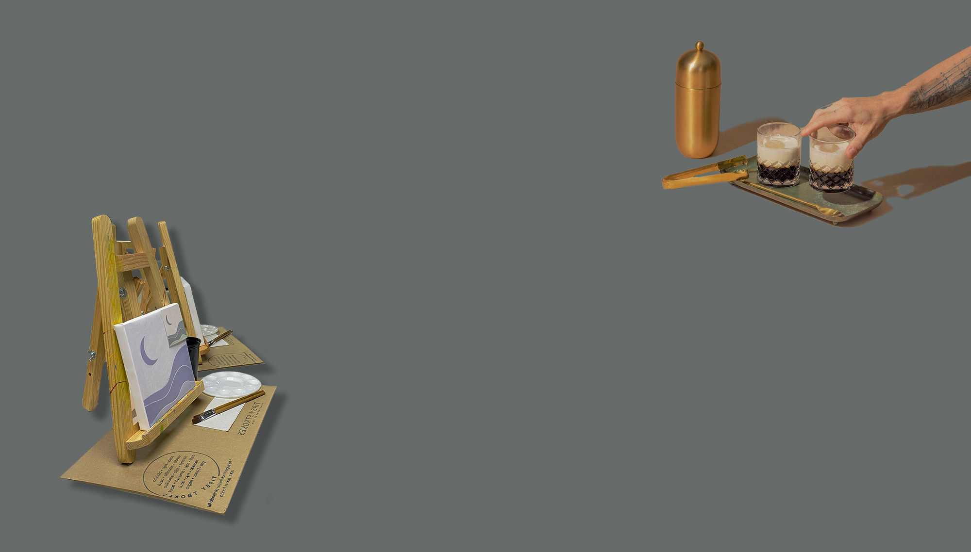 Two cocktail glasses on a wooden cutting board with two orange slices  that have juice spilling out underneath, and a knife sticking out of the board. A man setting a cocktail down on a tray with a shaker glass and ice cube tongs next to the tray.